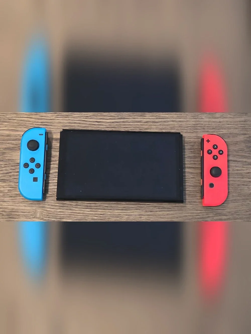 Nintendo Switch OLED - Neon Blue/Neon Red Renewed